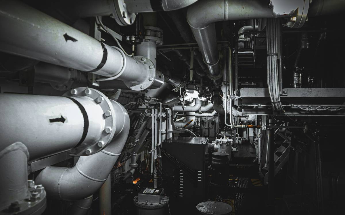 Technician monitoring boiler sootblower operation during routine maintenance